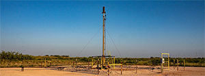 An inactive gas flare stands in Andrews, Texas